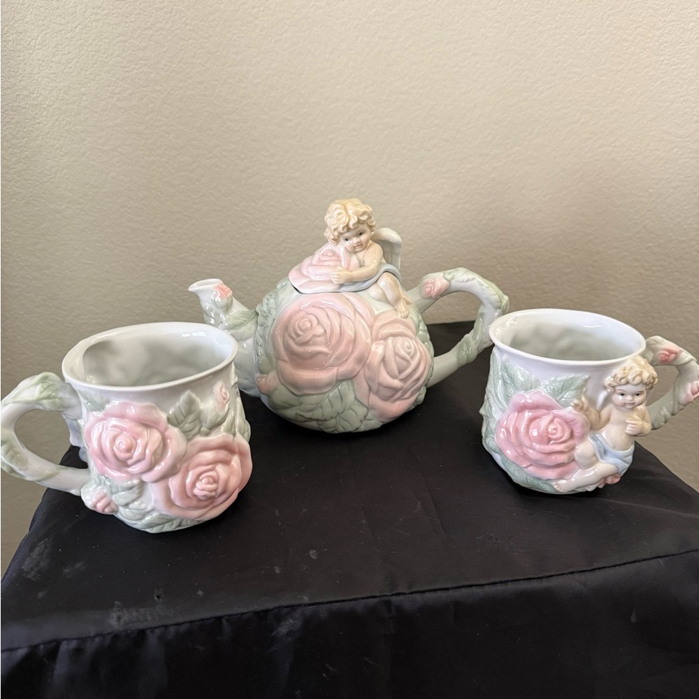 1998 Avon Cherub And Rose Floral Teapot and Mug Set .